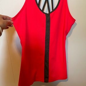 Bright pink tank with criss cross design in back!